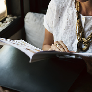 Person reading booklet.