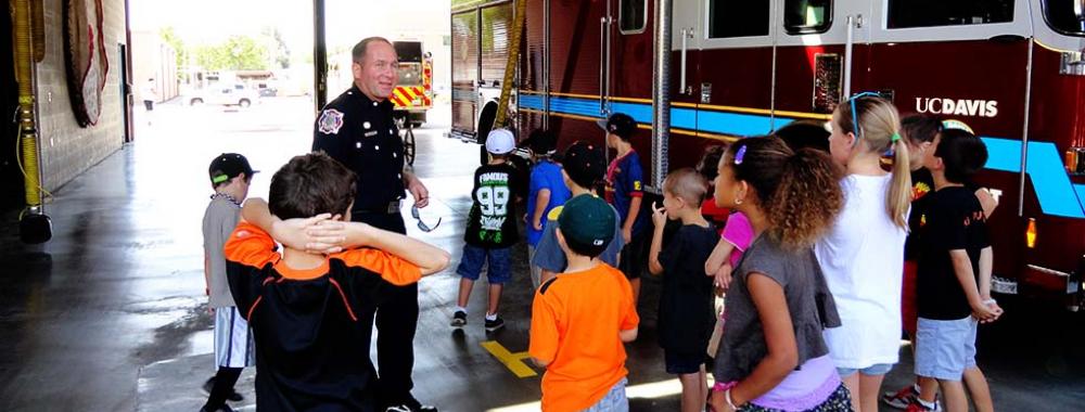fireman talking to a group of children