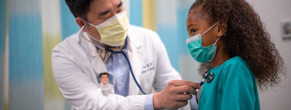 UC Davis Health physician with a young patient. 