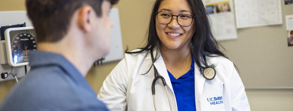 UC Davis Health doctor and patient in exam room. 