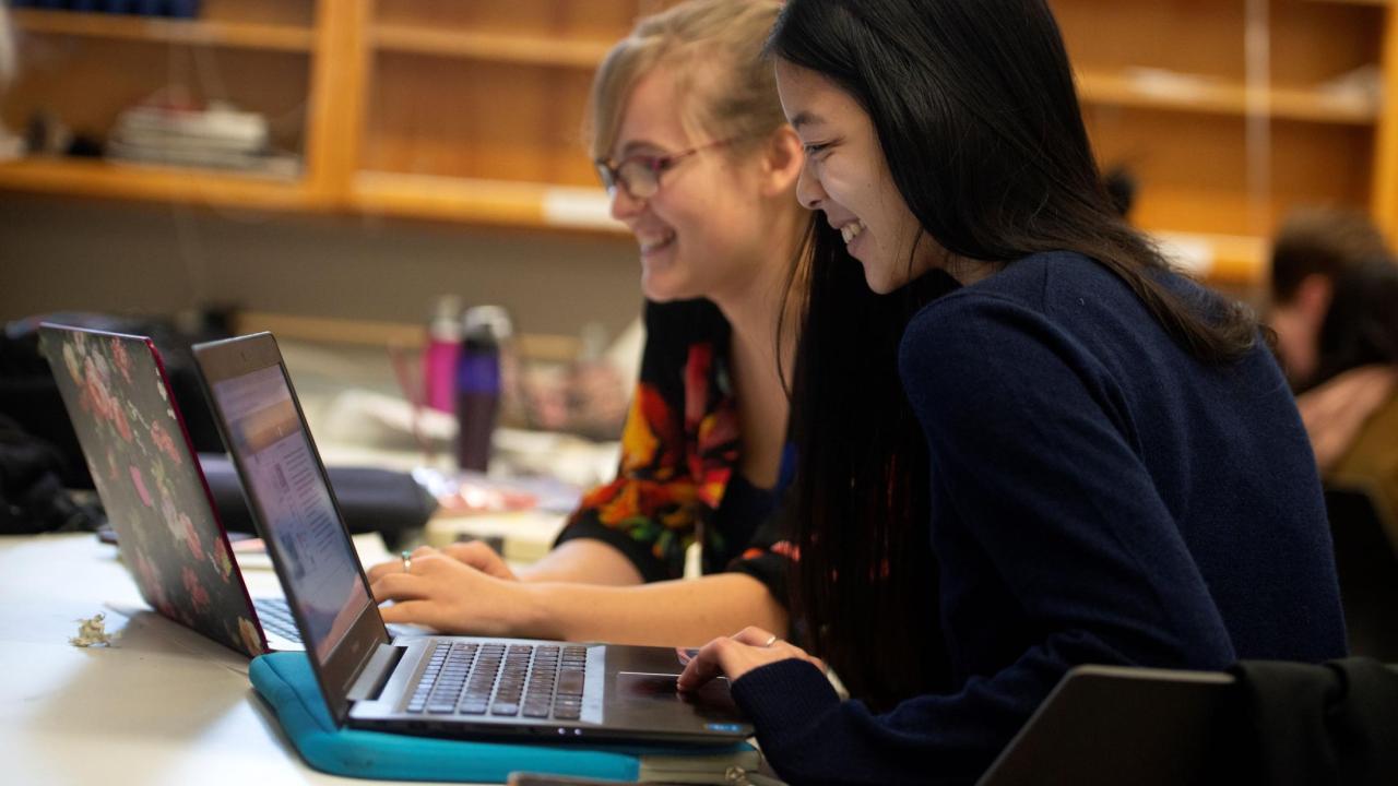 Students looking at a computer