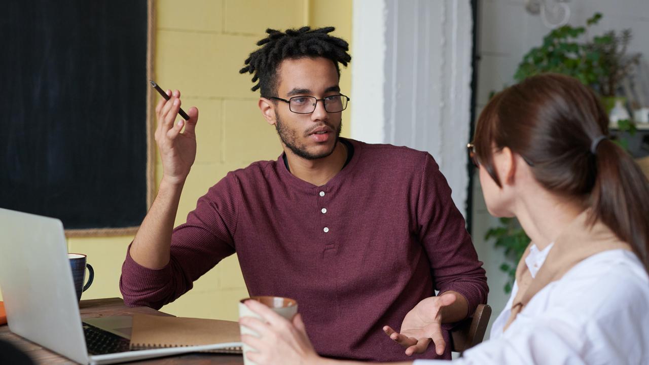 man and woman having a conversation