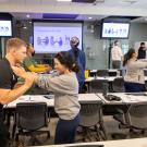 Participants engage in a hands-on training exercise in a classroom setting.