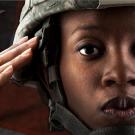 photo of soldier saluting with text Proud to Support our veteran community. Thank you for your service to the university and beyond.